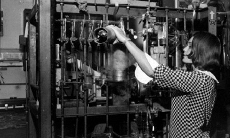 Young woman working with scientific equipment.