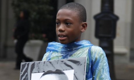 boy holding MLK image at 50th anniversary of March on Washington