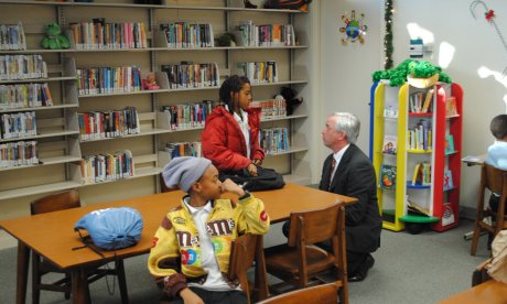 Color photo of the Chairman of Alabama Humanities chatting with a student