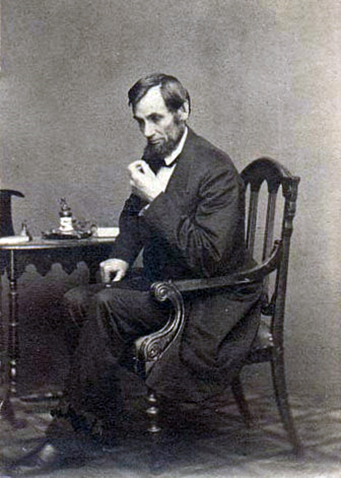Photo of Lincoln seated by Matthew Brady
