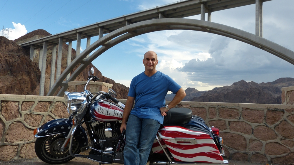 Peter Sagal, travels cross-country on a motorcycle.