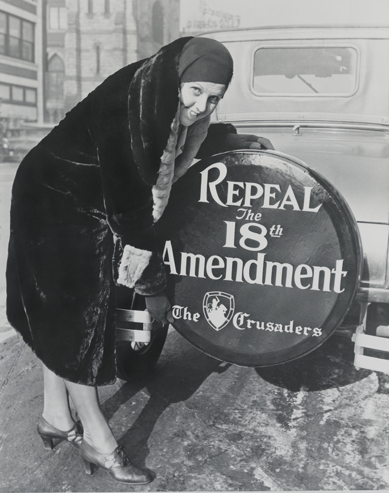 A "Crusader" poses in 1930 with a "Repeal the 18th Amendment" sign.