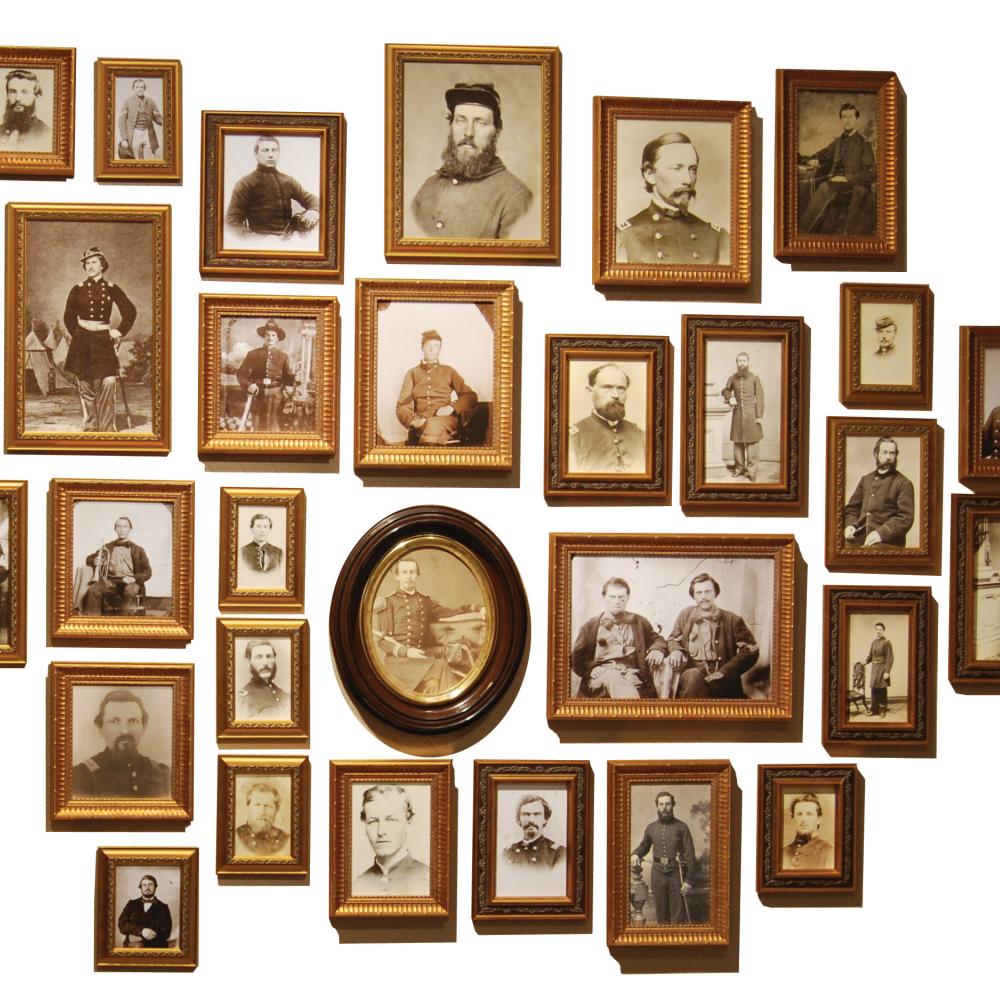 Collection of sepia photos of civil war soldiers, in wood frames