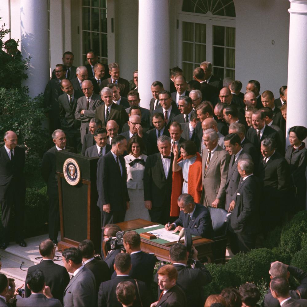 Color photo of the ceremony where President Lyndon Johnson signed the NEH into law.