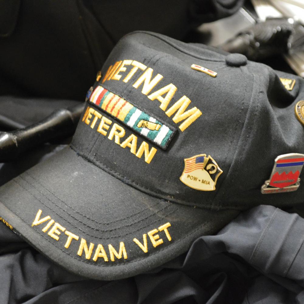 Color photo of a black baseball cap that says "Vietnam Veteran" on it.
