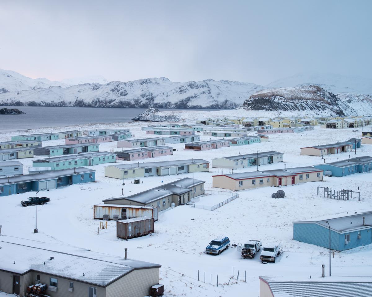 Wide shot photography of a series of houses and a snowy landscape