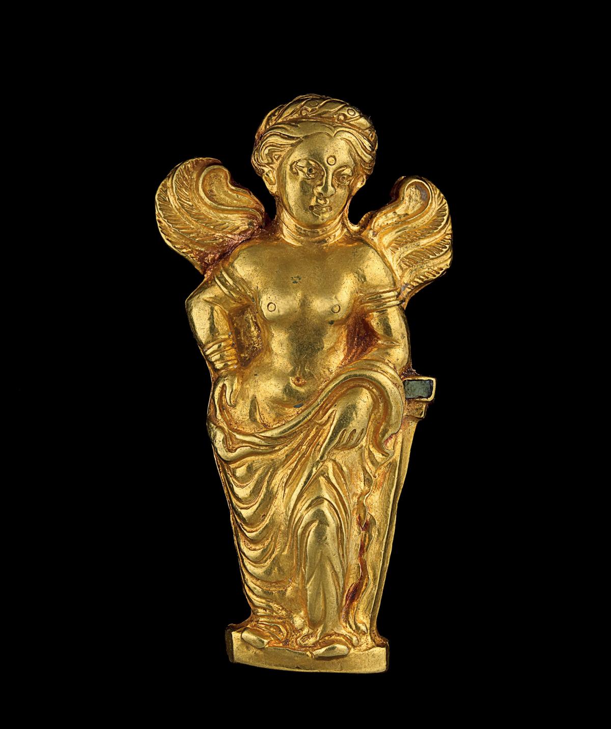 Small golden statue of a woman with wings 