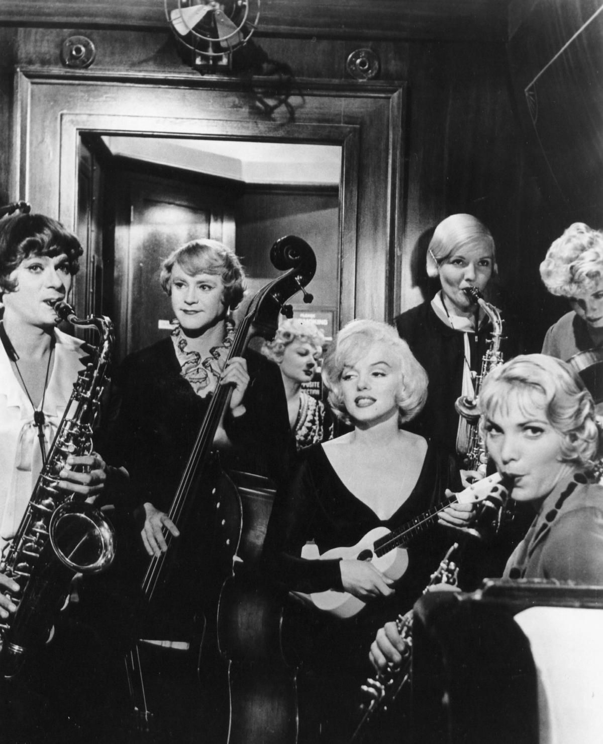 black and white film still of three women playing musical instruments