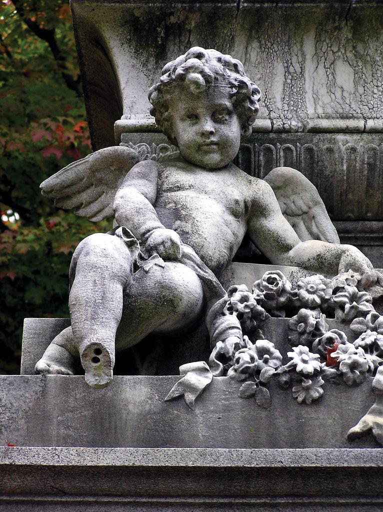 Photograph of a cherub carved out of stone
