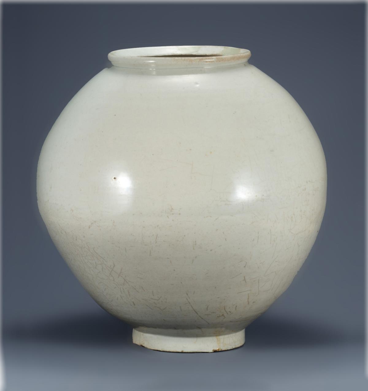 White porcelain jar, wide in the middle, with a narrower mouth and base