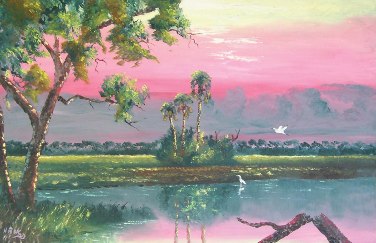 Pink skies over a marshy lake, with green trees