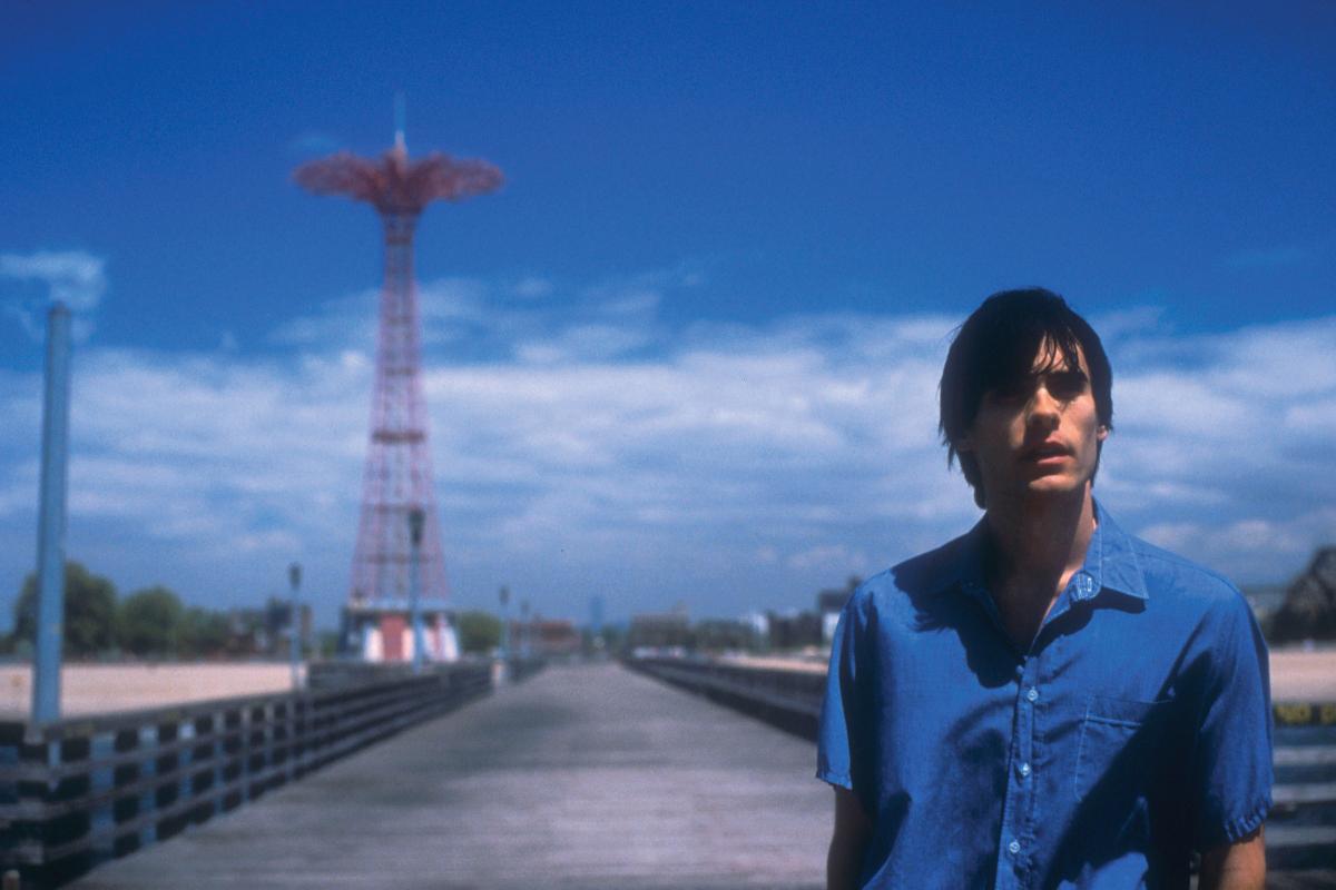 Movie still from Requiem for a Dream, showing the protagonist in a blue shirt at Coney Island