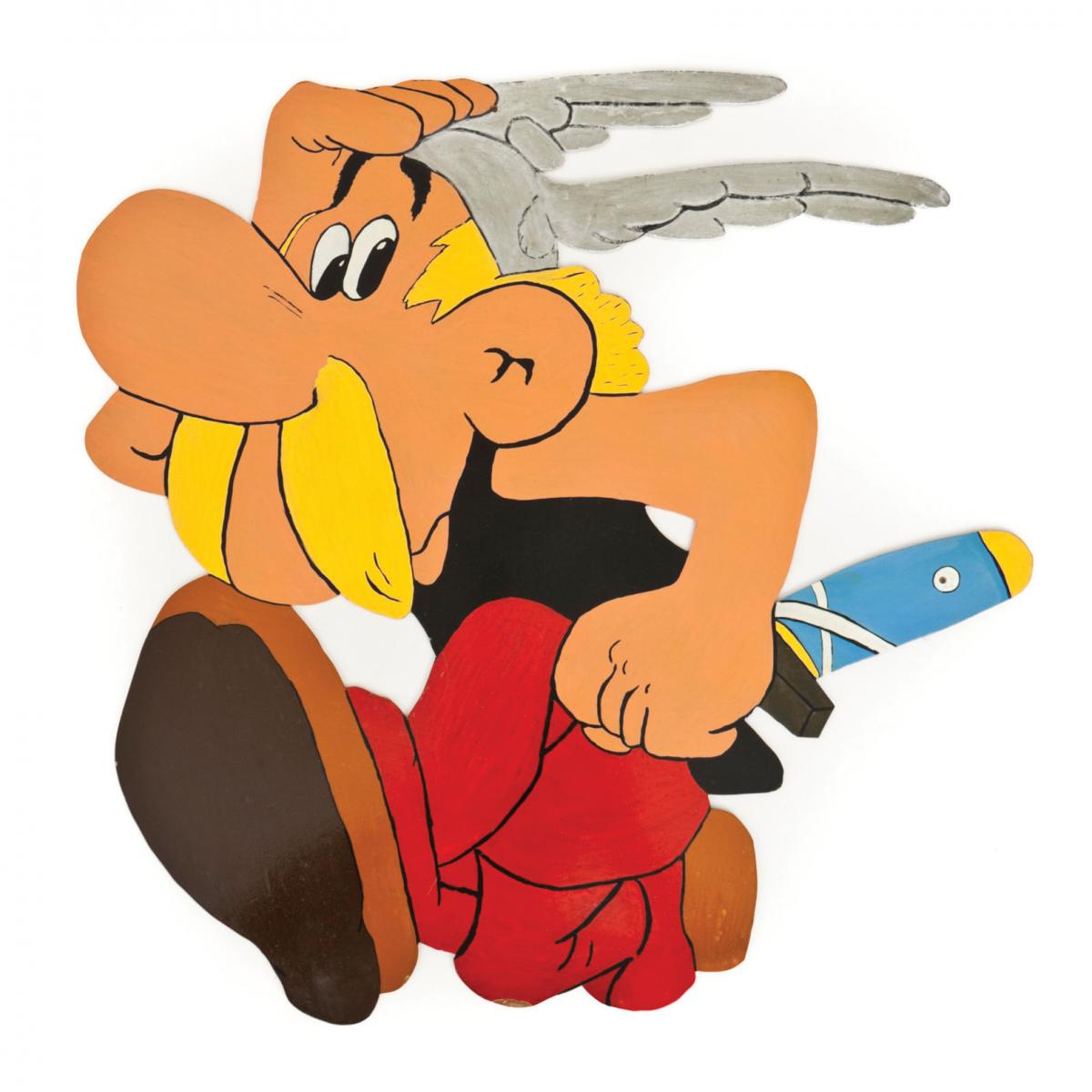Astérix, a cartoon character with a yellow mustache, wearing red pants and carrying a sword