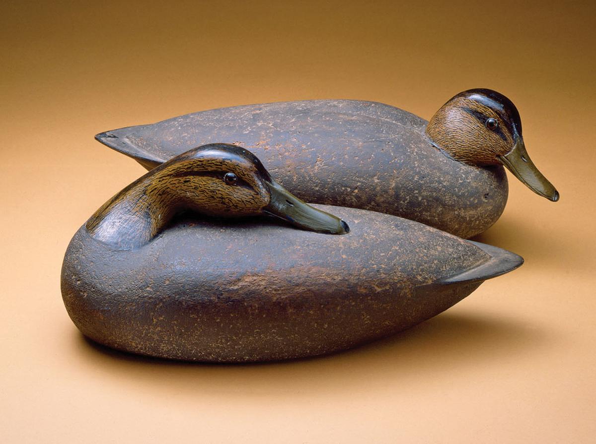 two wooden carved ducks