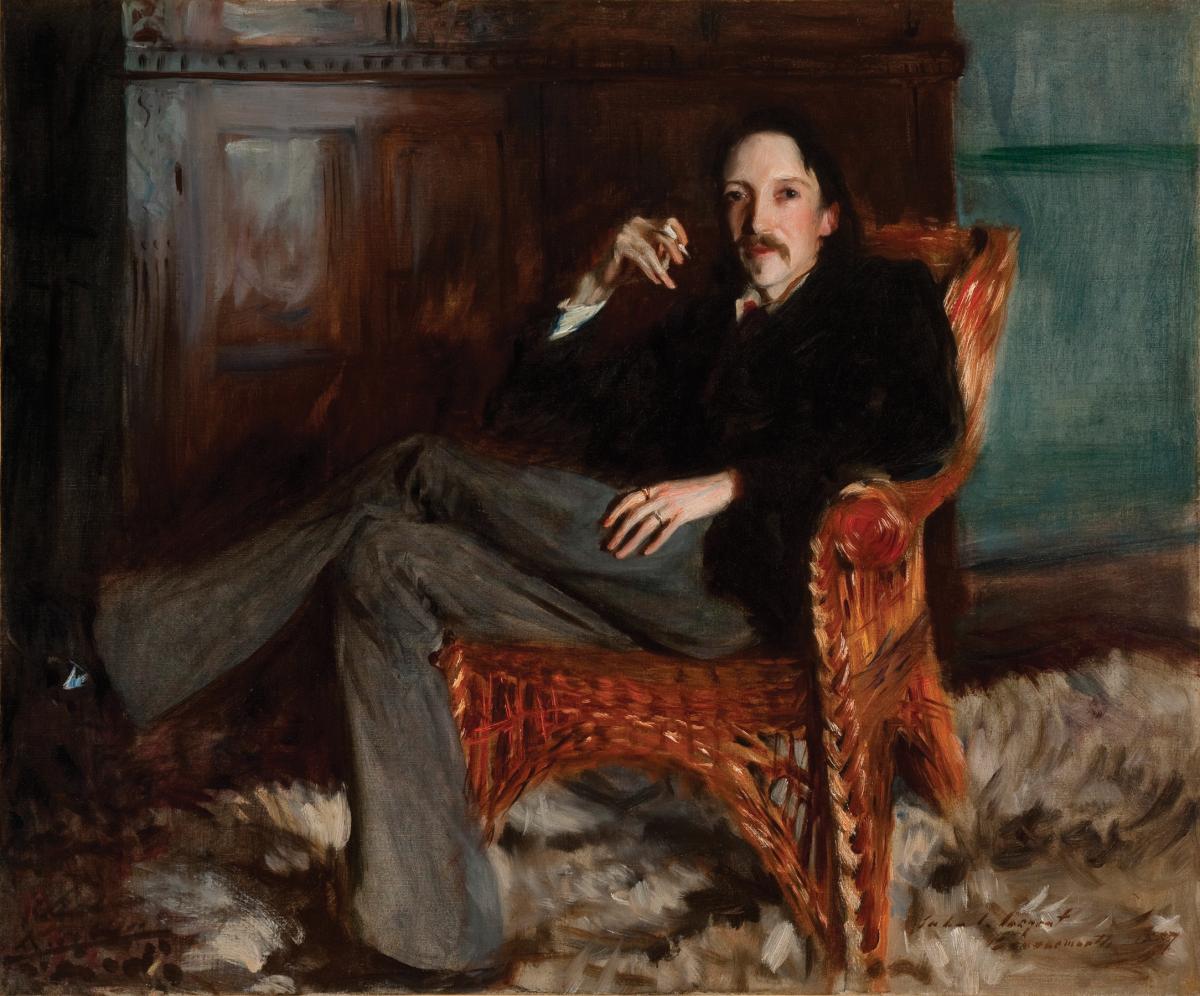 Stevenson sitting in a leather arm chair, legs crossed, holding a cigarette, wearing a dark suit