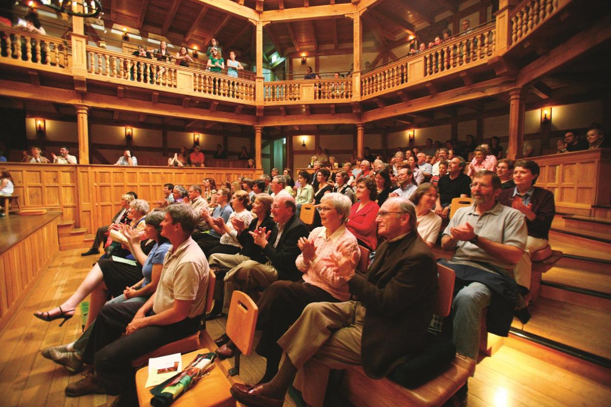 Photograph of an audience applauding