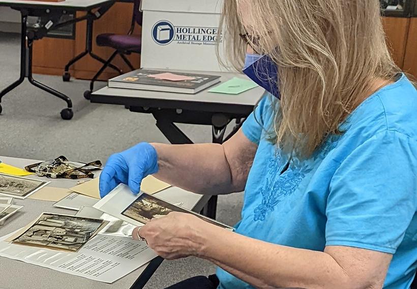 UMBC researcher working on the Hine photographs