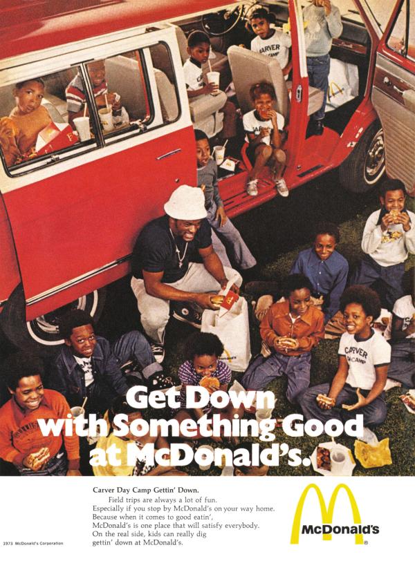 Black man with camper and campers "Get Down with Something Good at McDonalds"
