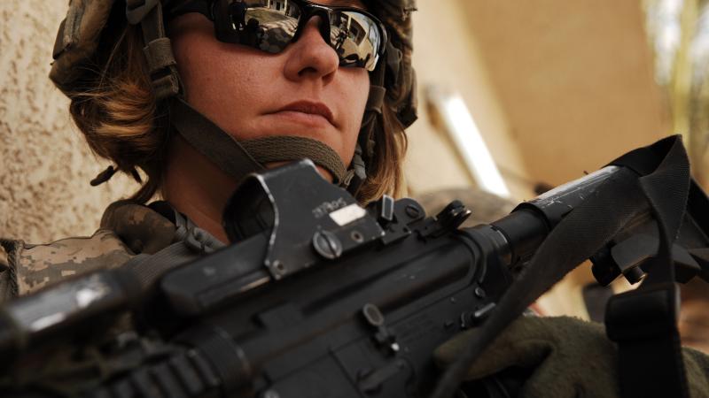Female American soldier in Iraq, in full field uniform.