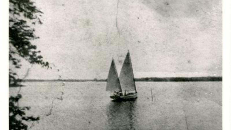 black and white photo of a sailboat
