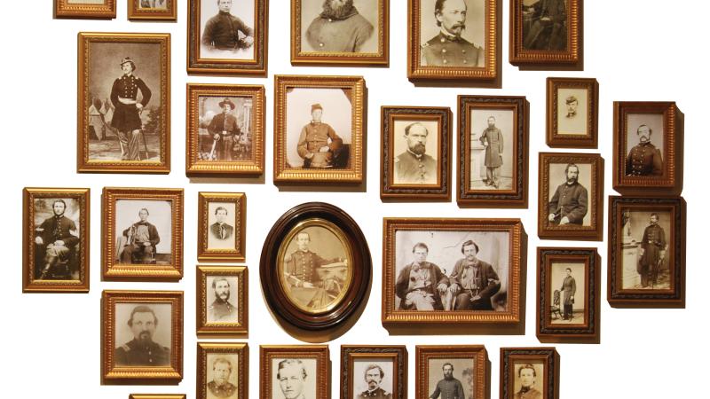 Collection of sepia photos of civil war soldiers, in wood frames