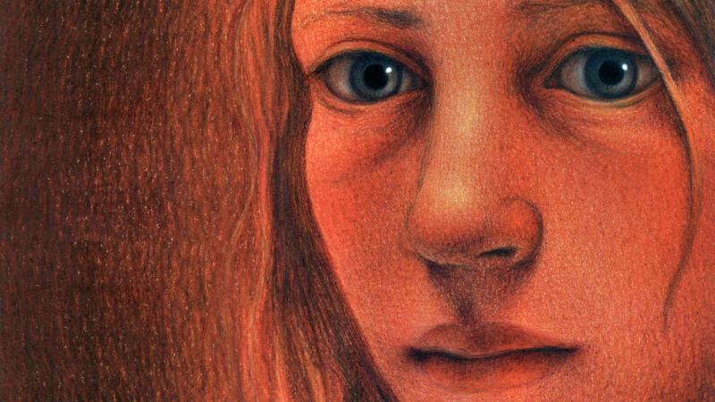 A reddish-hued portrait of a young girl, close up.