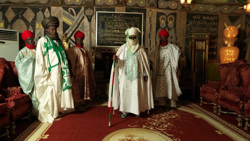 5 members of the royal court, wearing traditional clothing