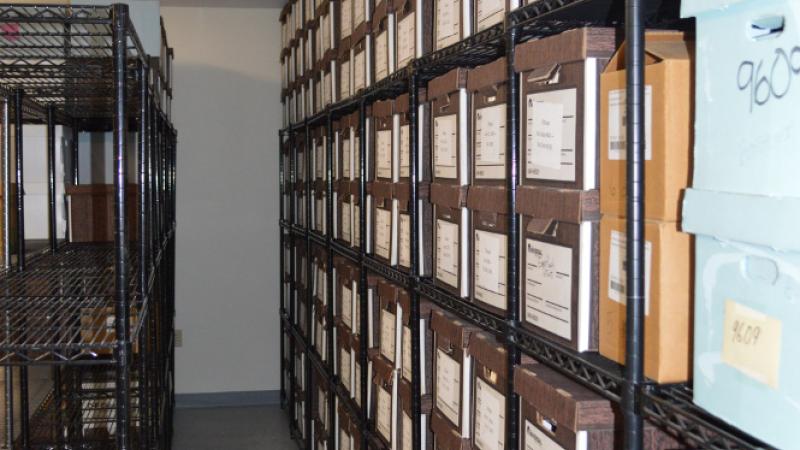 photograph of a wall of file boxes