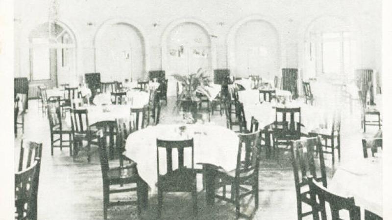 black and white photo of a dining room