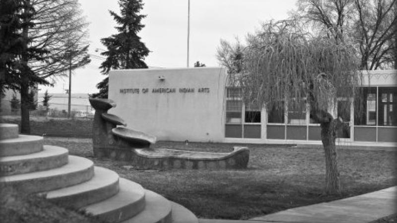 black and white photo of administration building sign