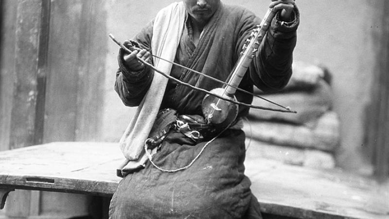 Musician with Instrument, Shache, China, photographed by Helmet De Terra, ca.1928.
