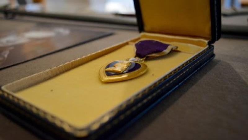 photo of a purple heart medal in an open box