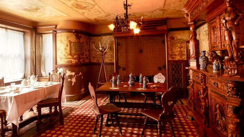 Photograph of a room with tables and beer steins