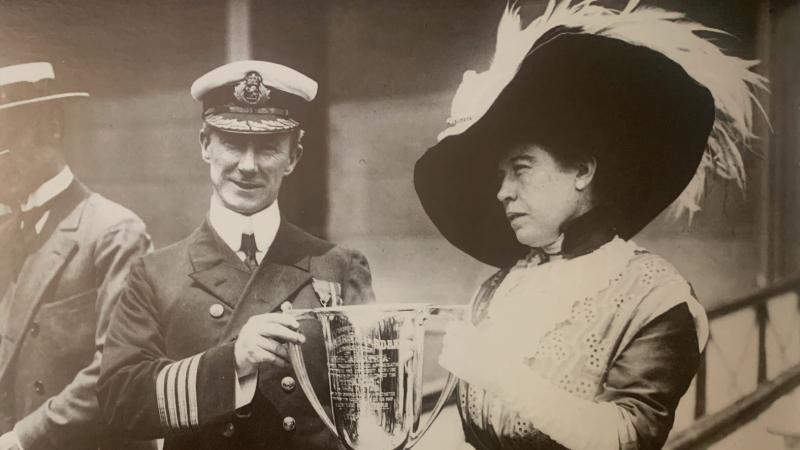 Brown presents a loving cup to A. H. Rostron, captain of the RMS Carpathia, to commemorate his rescue of the Titanic's survivors.