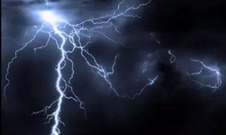 Picture of a lightning bolt striking from the sky over a dark background. 