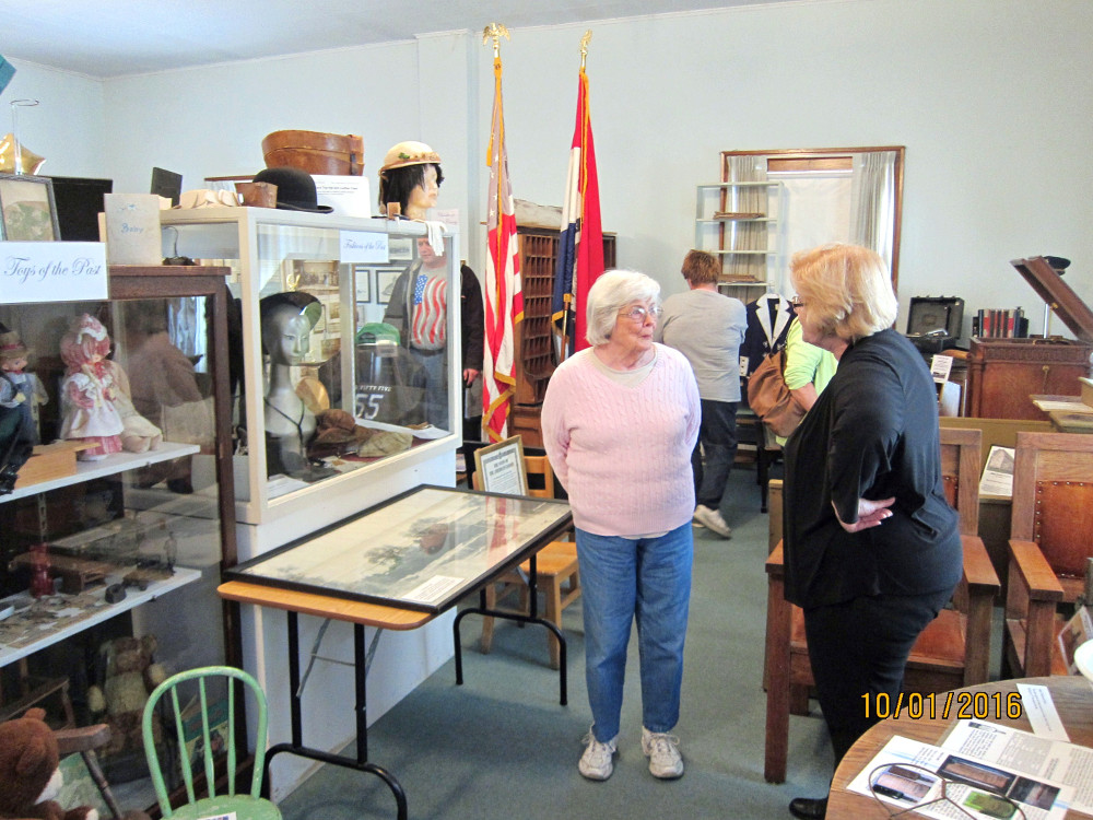Visitors in the upstairs gallery of the Adair County Historical Society.