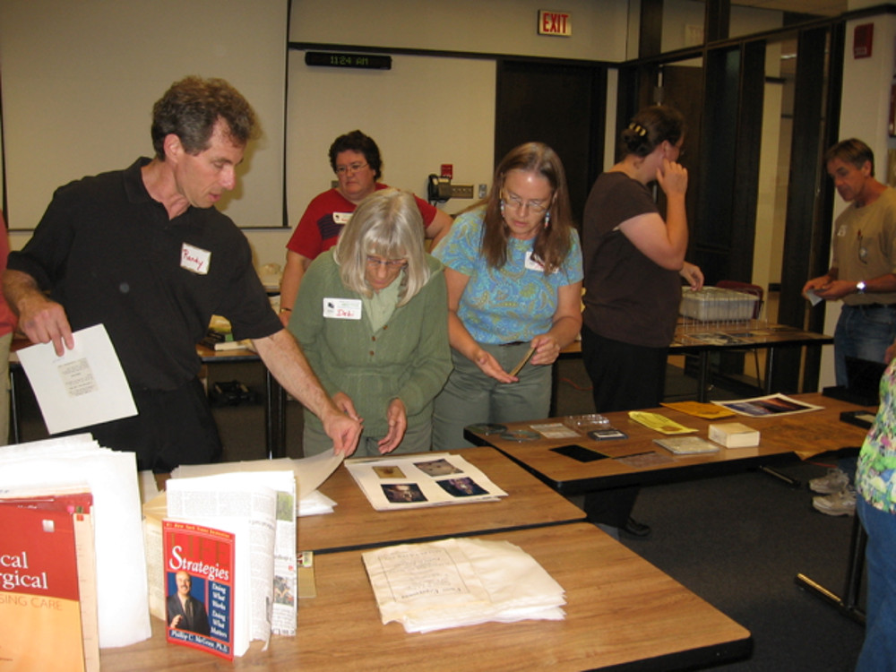 Randy Silverman demonstrating drying techniques for paper-based records and book