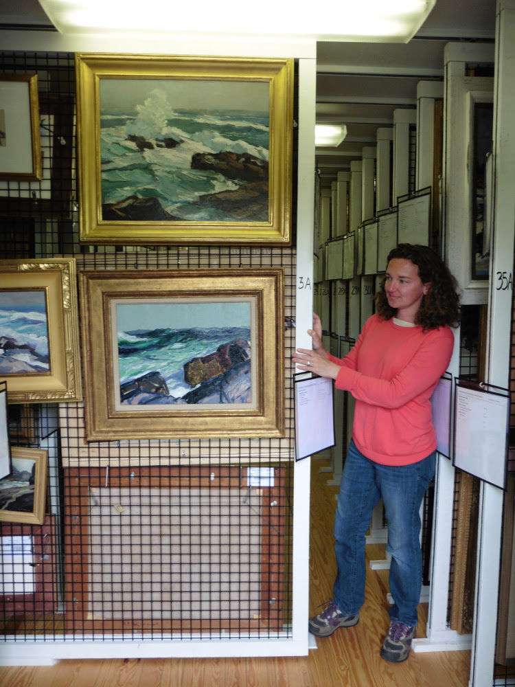 Jennifer Pye, Curator of Collections, showing the custom painting racks.