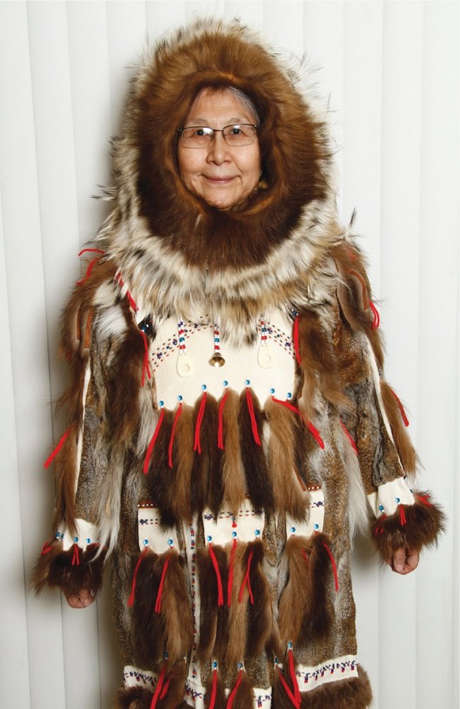 Theresa John wearing a fur parka with arrow-point designs.