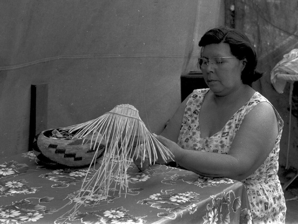 Essie Parrish weaving baskets, c. 1960s.