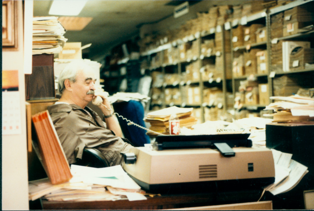 Jim Kepner on the phone at the National Gay Archives. 1986.
