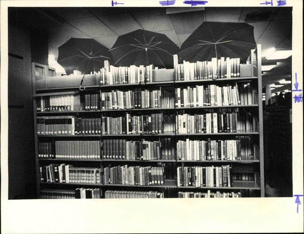 Clearwater Main Library bookstacks under a roof leak in 1978