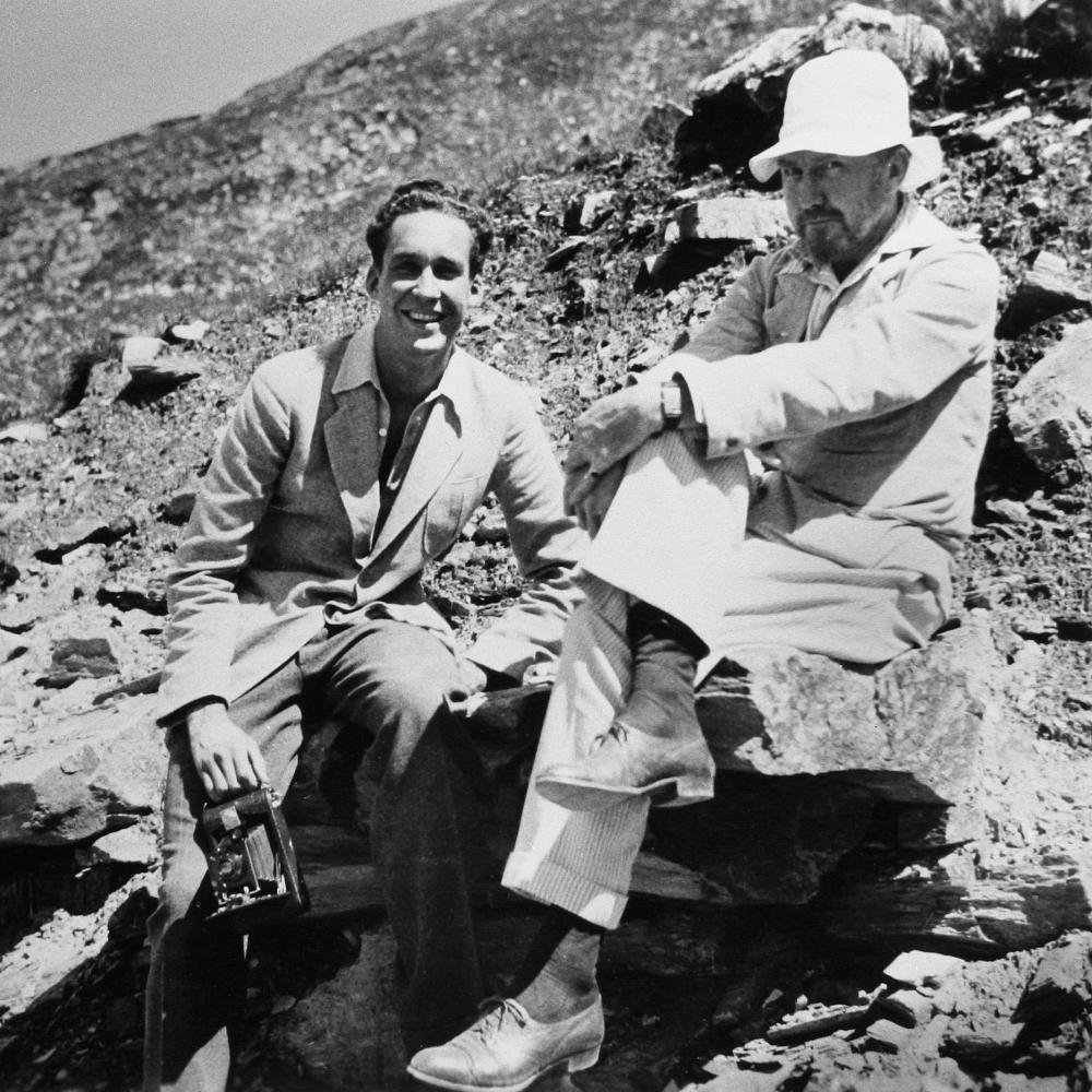 A young James Laughlin and Ezra Pound in Rapallo, sitting on the rocks