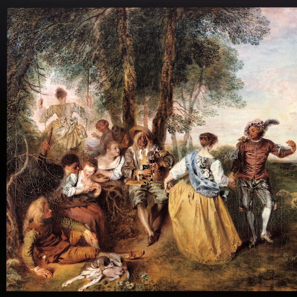 A group of actors and actresses play a scene in a woodland clearing