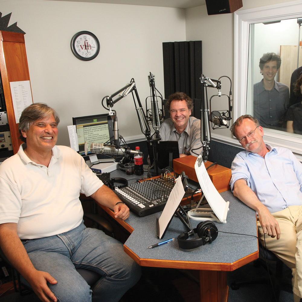 The team lounges in their studio, surrounded by their recording equipment