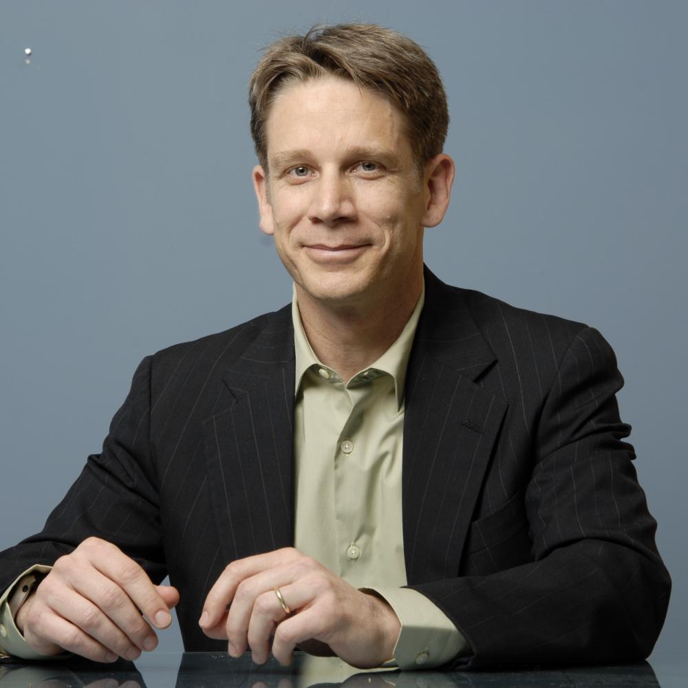 Photograph of a man on a grey background