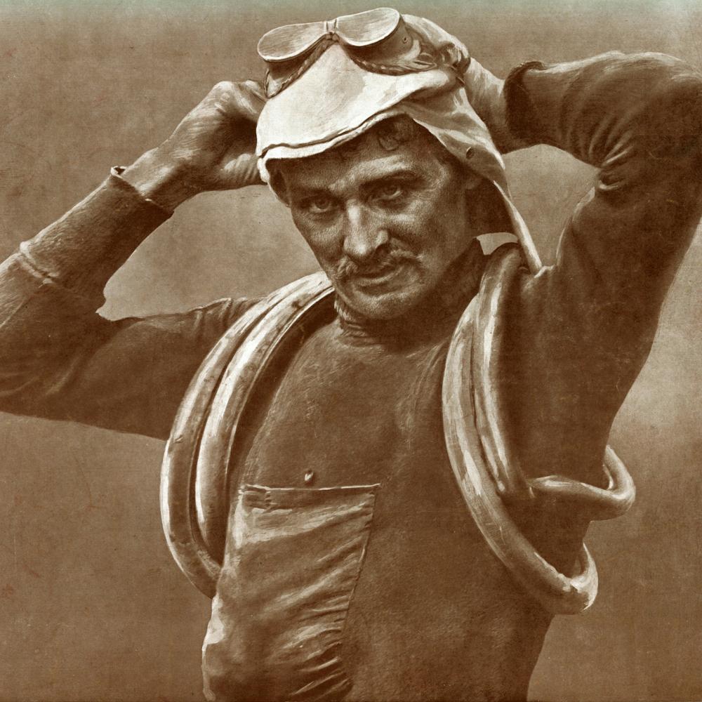 Sepia-colored photo of cyclist Francois Faber adjusting his riding goggles.