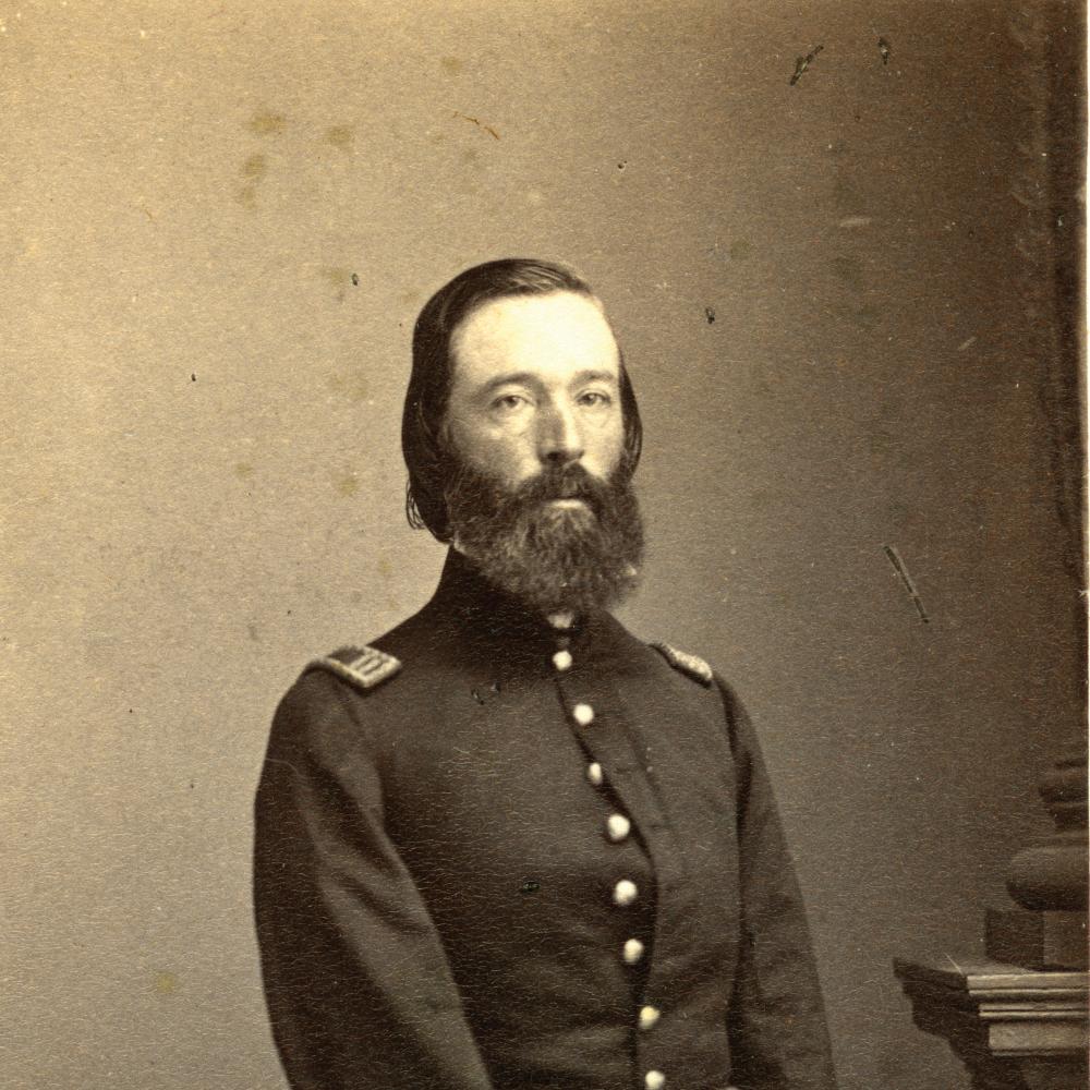 Sweeny in a buttoned military coat