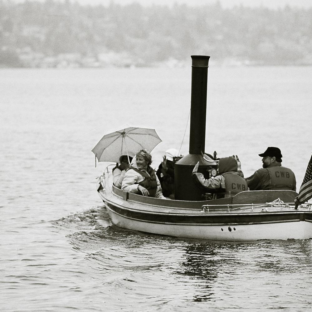 Photograph of a small wooden boat in the water 