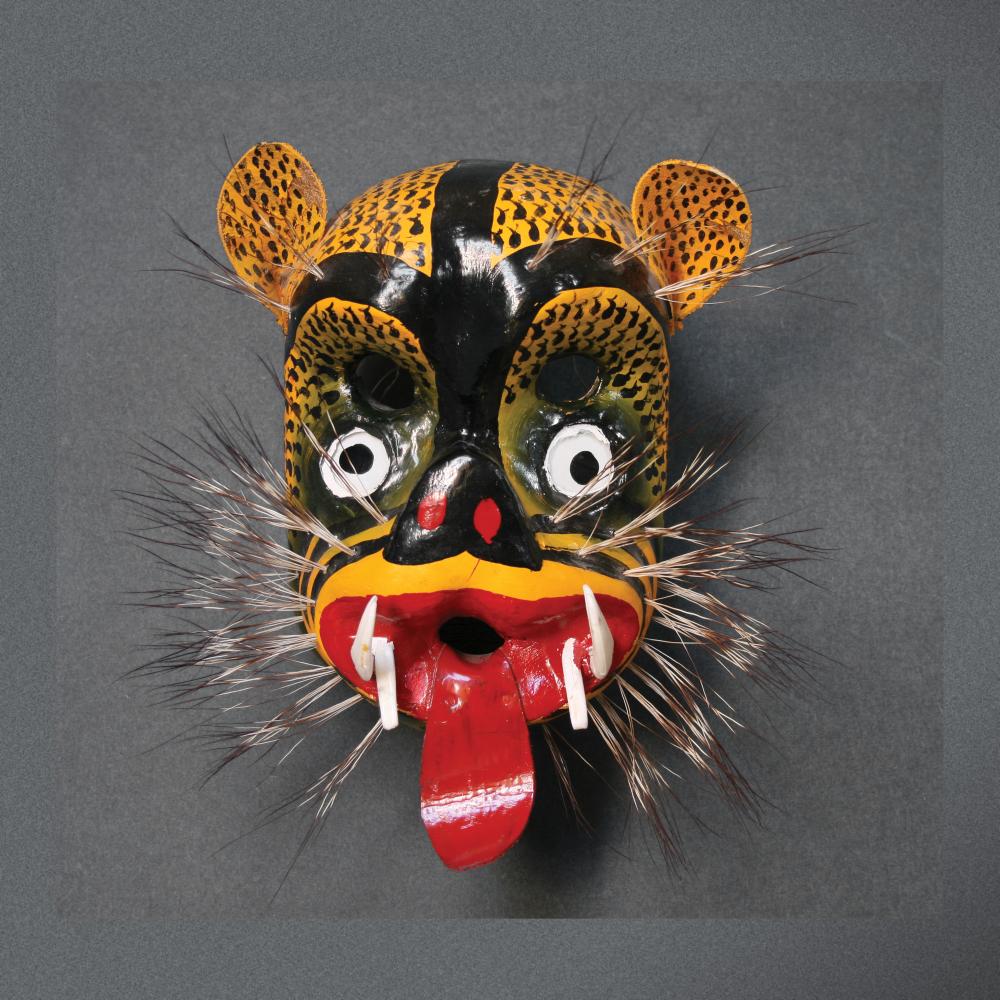 Photograph of a wooden mask, colorful